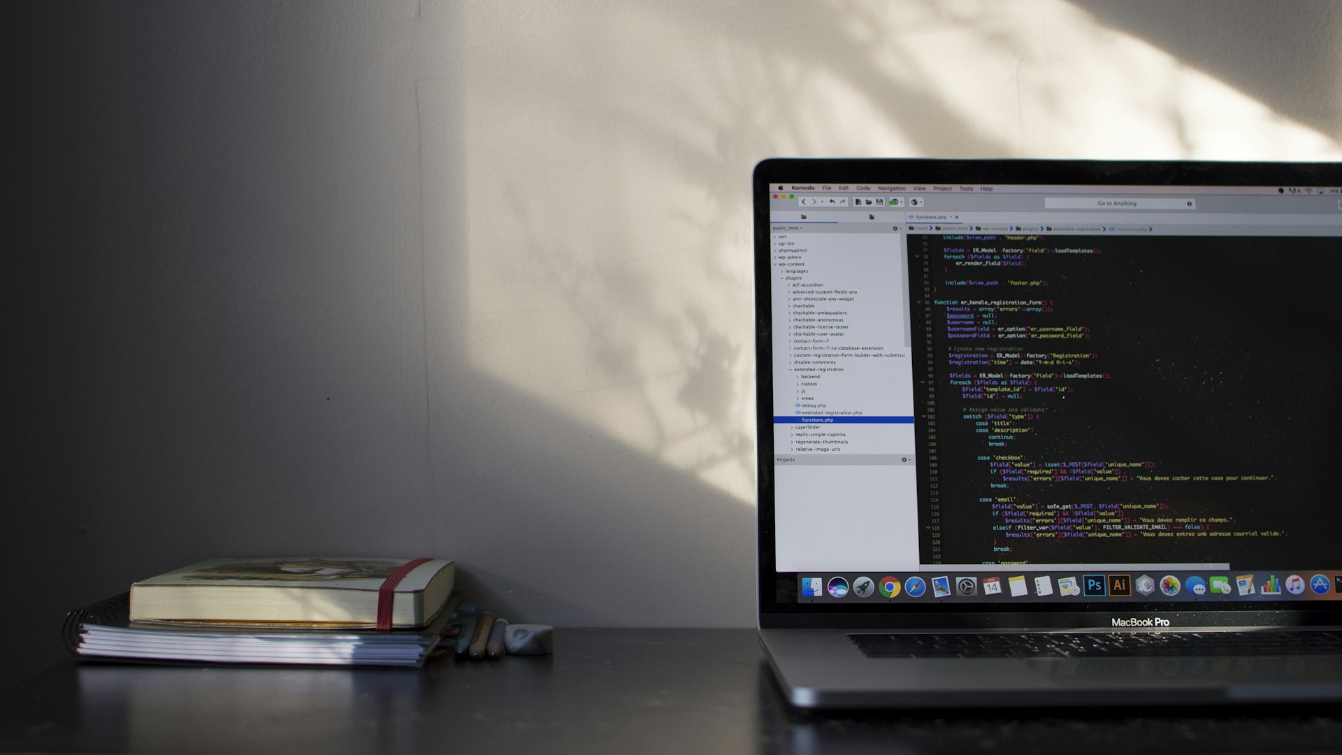 Laptop displaying code on a desk